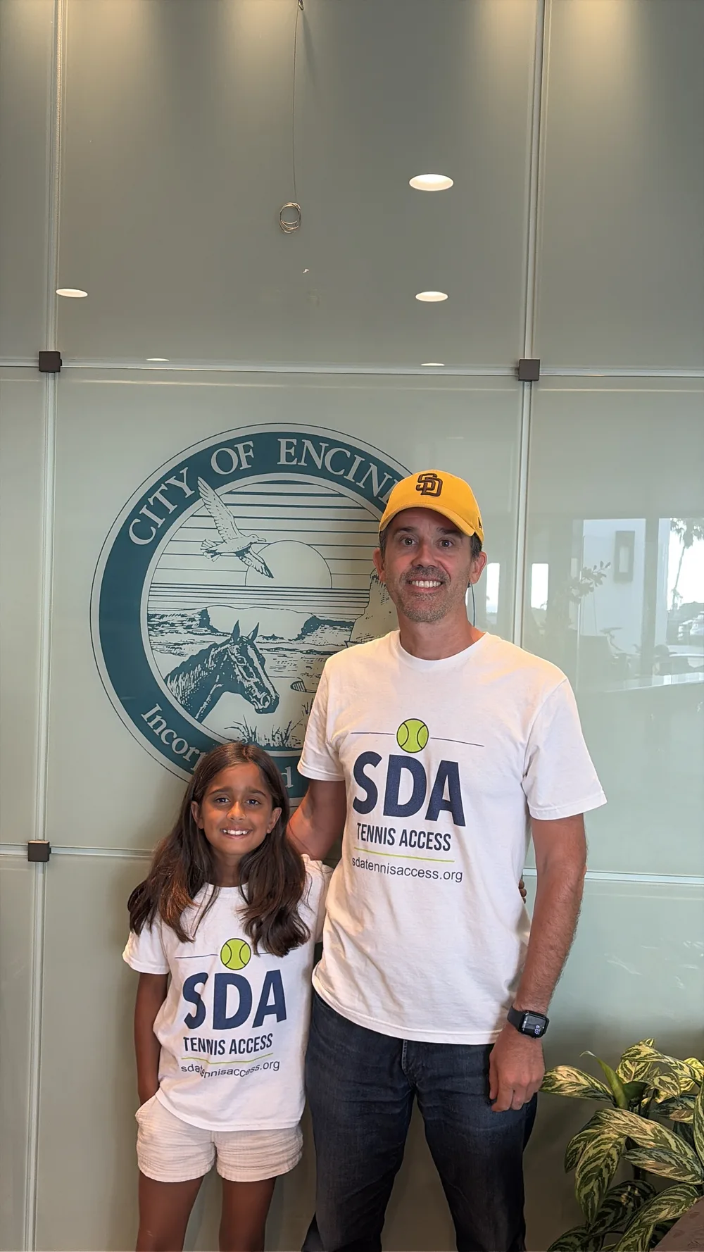 Jeff Sherin and his daughter wearing SDA Tennis Access shirts at Encinitas City Hall